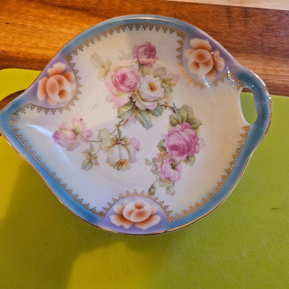 vintage hand painted porcelain dish with a delicate rose pattern and gold trim